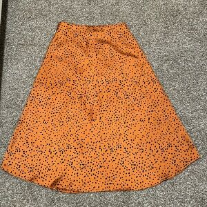 SHEIN ORANGE AND BLACK PRINT midi skirt size XS